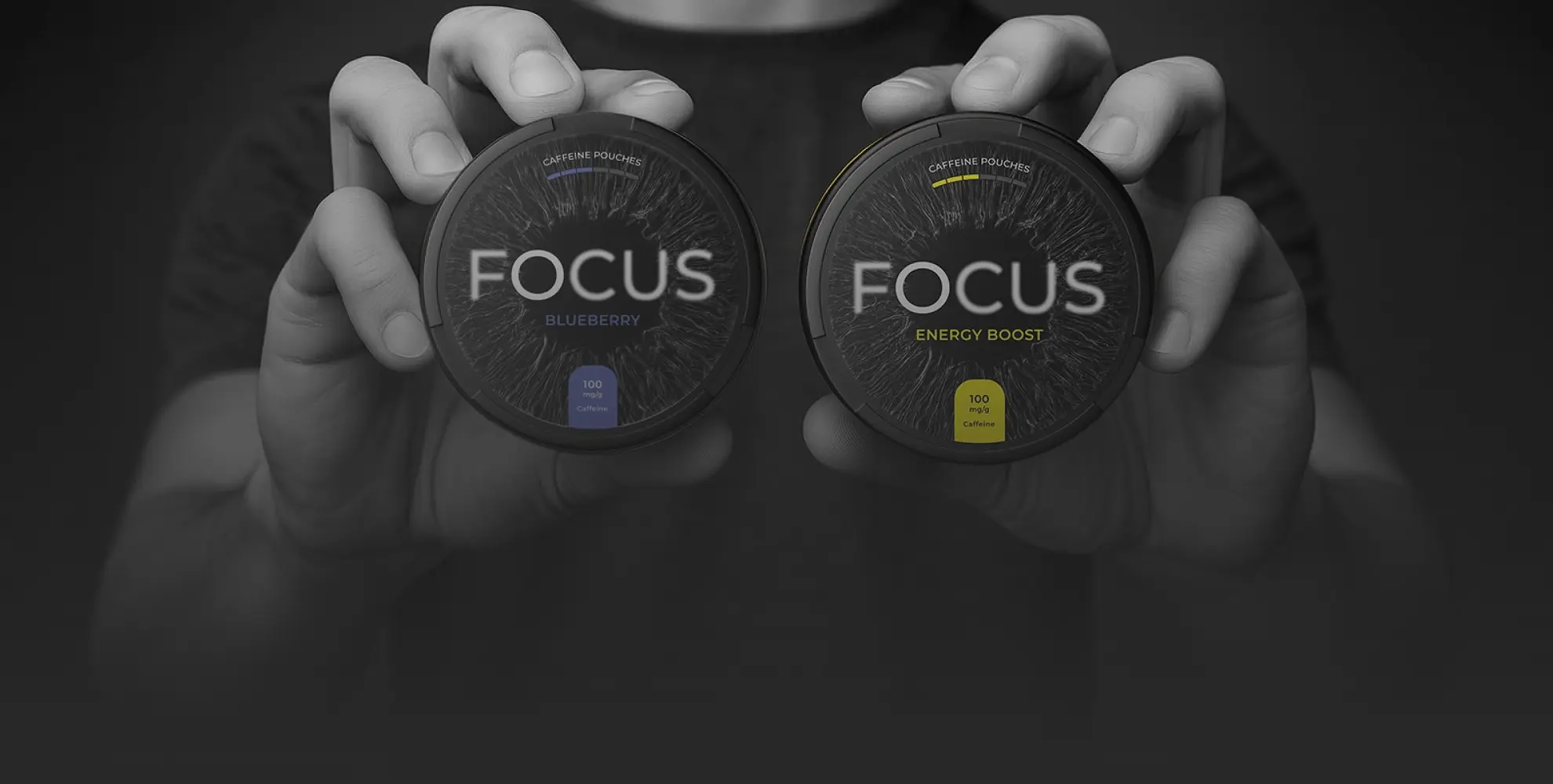 FOCUS Energy Boost and Blueberry cans held in two hands